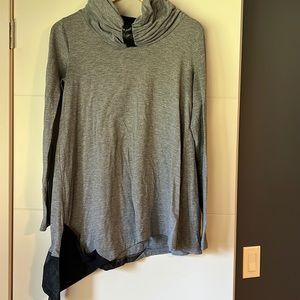 Women’s asymmetrical, long sleeve sweater with leather details